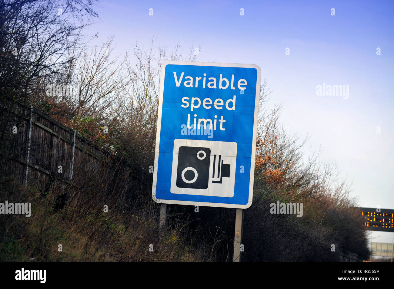 UK motorway warning sighn, variable speed limit Stock Photo Alamy