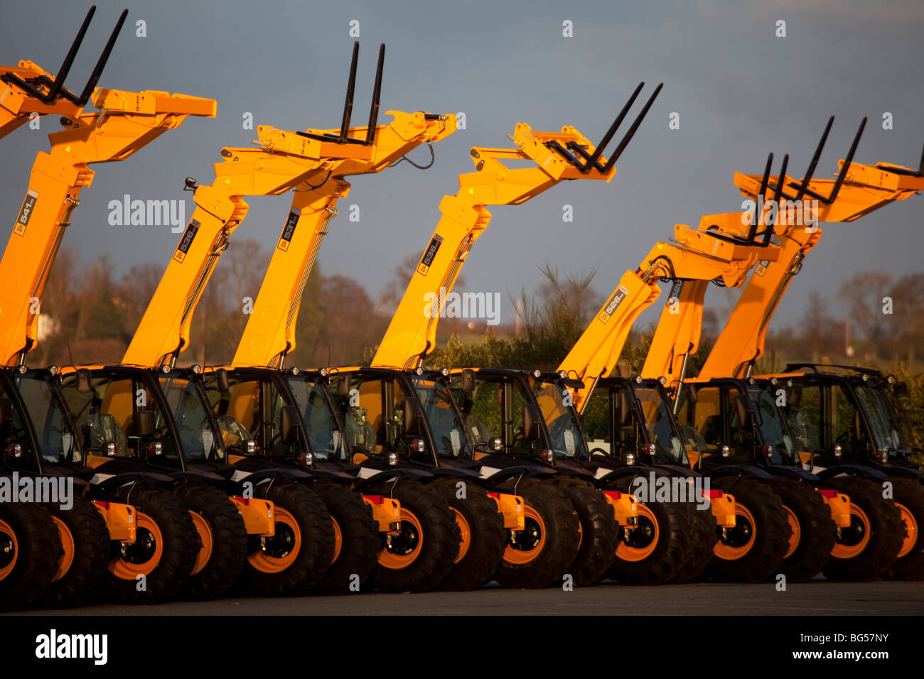JCB line of new vehicles at Storage Yard, Derbyshire, UK Stock Photo