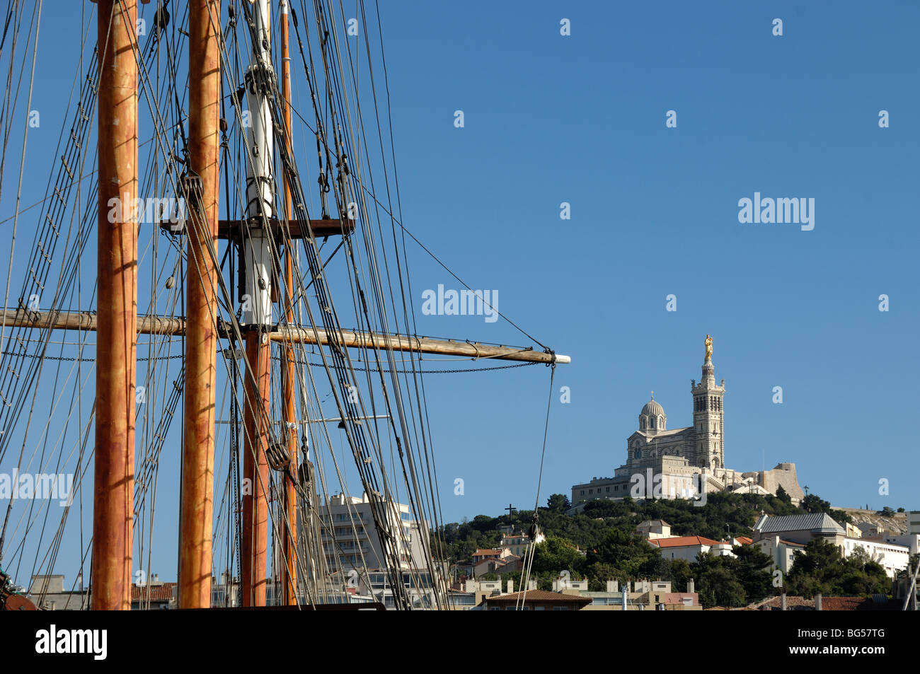 Wooden Masts & Rigging of Yachts in Old Port & Notre-Dame de la Garde Church, Marseille or Marseilles, Provence, France Stock Photo
