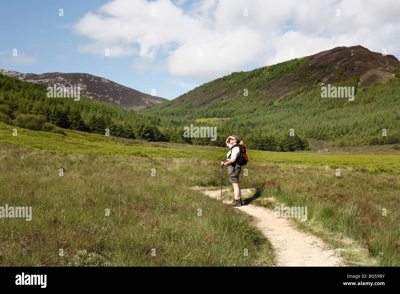 Woman walking at North Glen Sannox, The Isle of Arran, Scotland, June 2009 Stock Photo