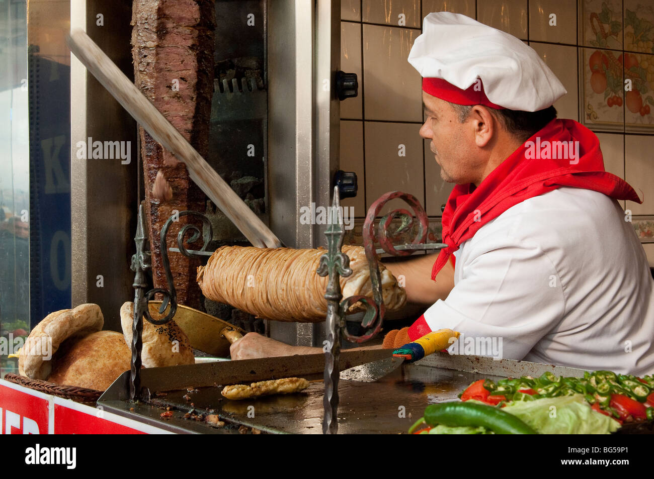 Slicing doner mean from a revolving spit Stock Photo - Alamy