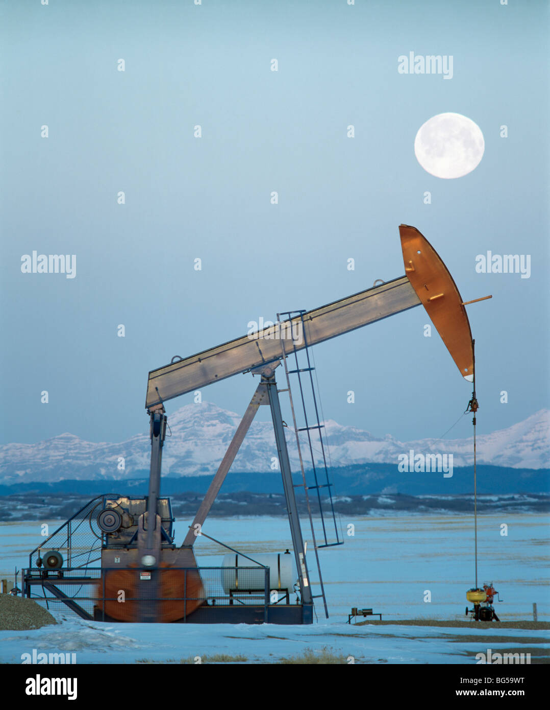 Pump Jack and mountains, Alberta, Canada Stock Photo Alamy