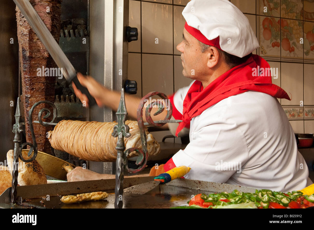 Slicing doner mean from a revolving spit Stock Photo - Alamy