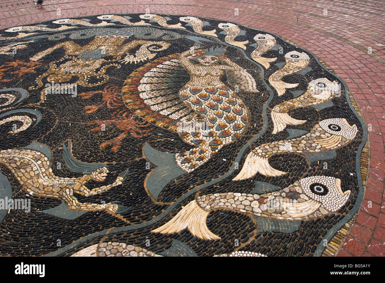 Close up of a large pebble mosaic by Maggie Howarth in The Square Bournemouth It has an appropriate seaside theme Stock Photo