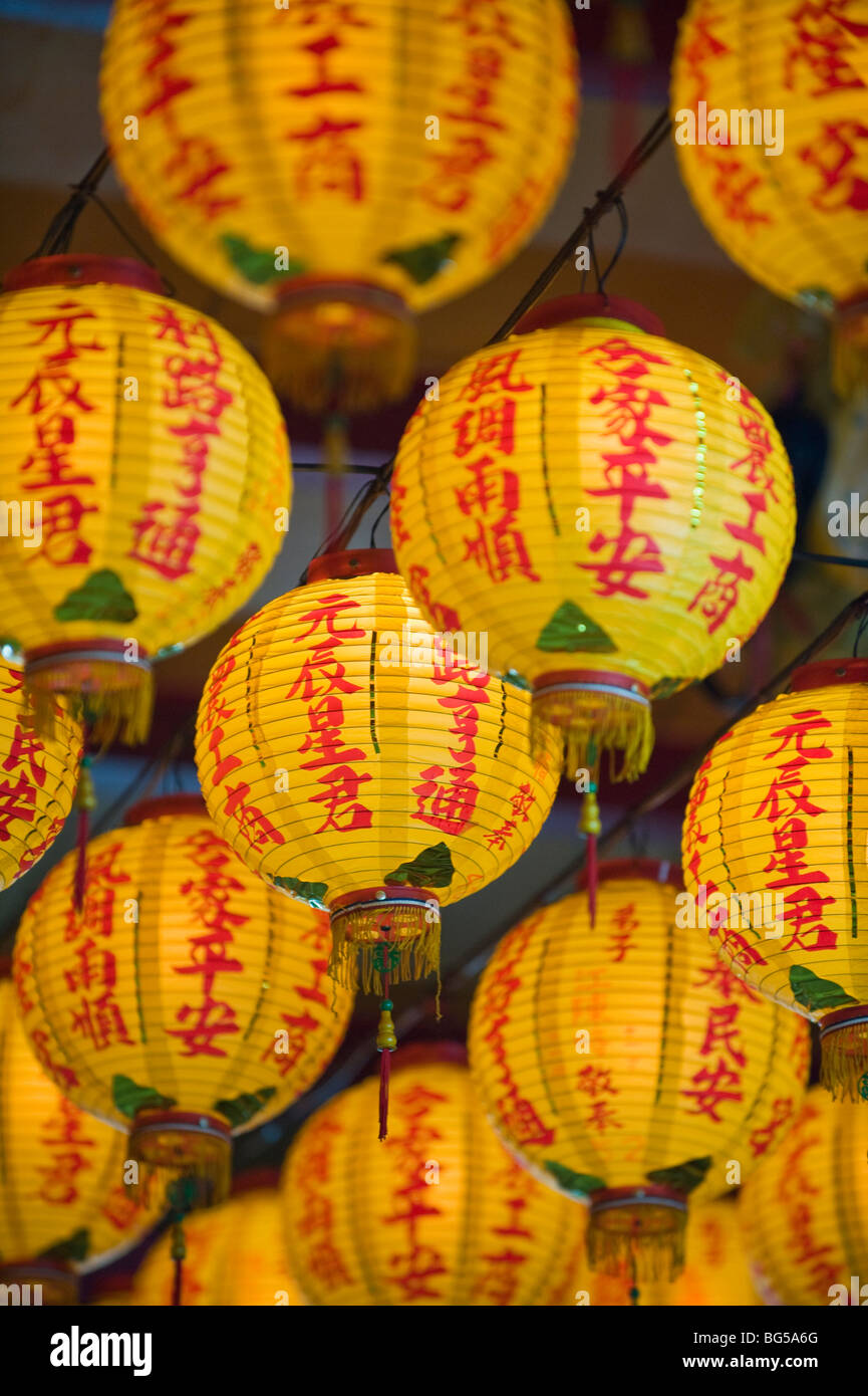 Yellow Chinese Lanterns hanging from the ceiling of a Daoist temple in