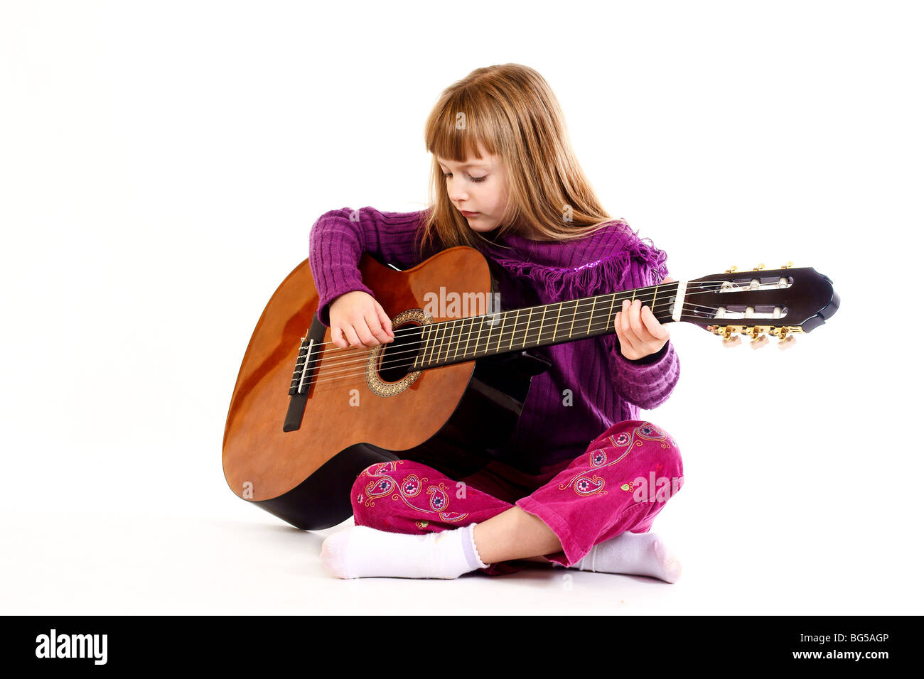Young girl playing acoustic guitar Stock Photo - Alamy