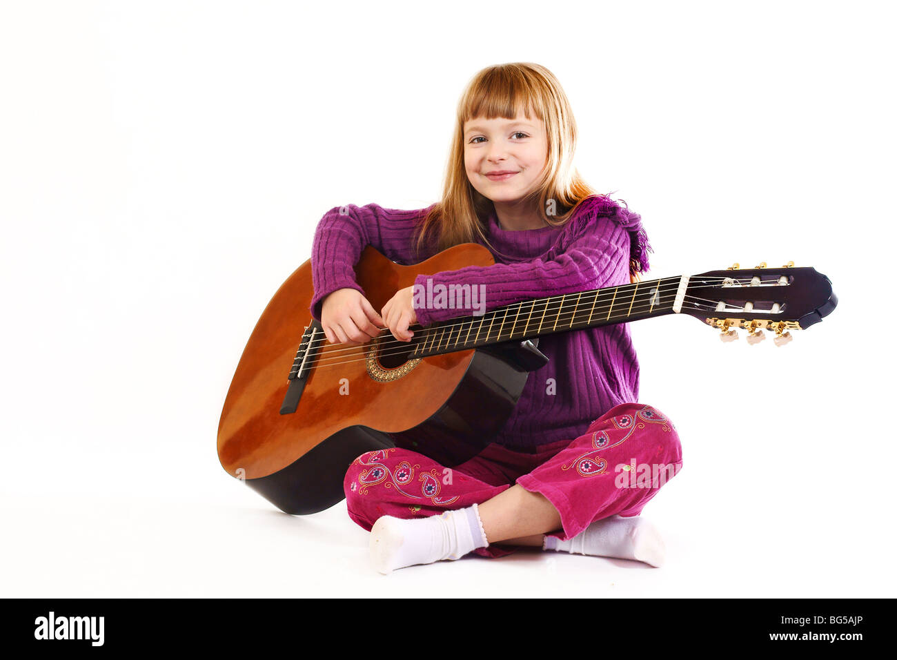 Young girl playing acoustic guitar Stock Photo - Alamy