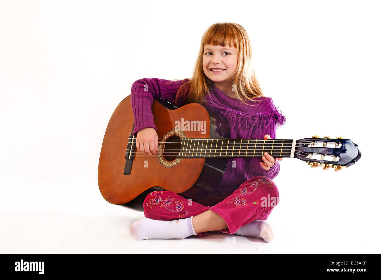 Young girl playing acoustic guitar Stock Photo - Alamy