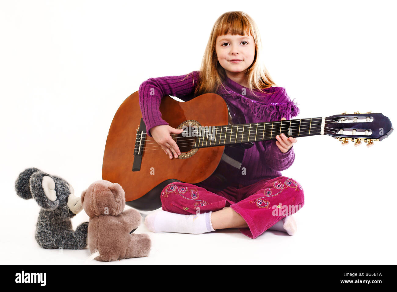 Young girl playing acoustic guitar Stock Photo - Alamy