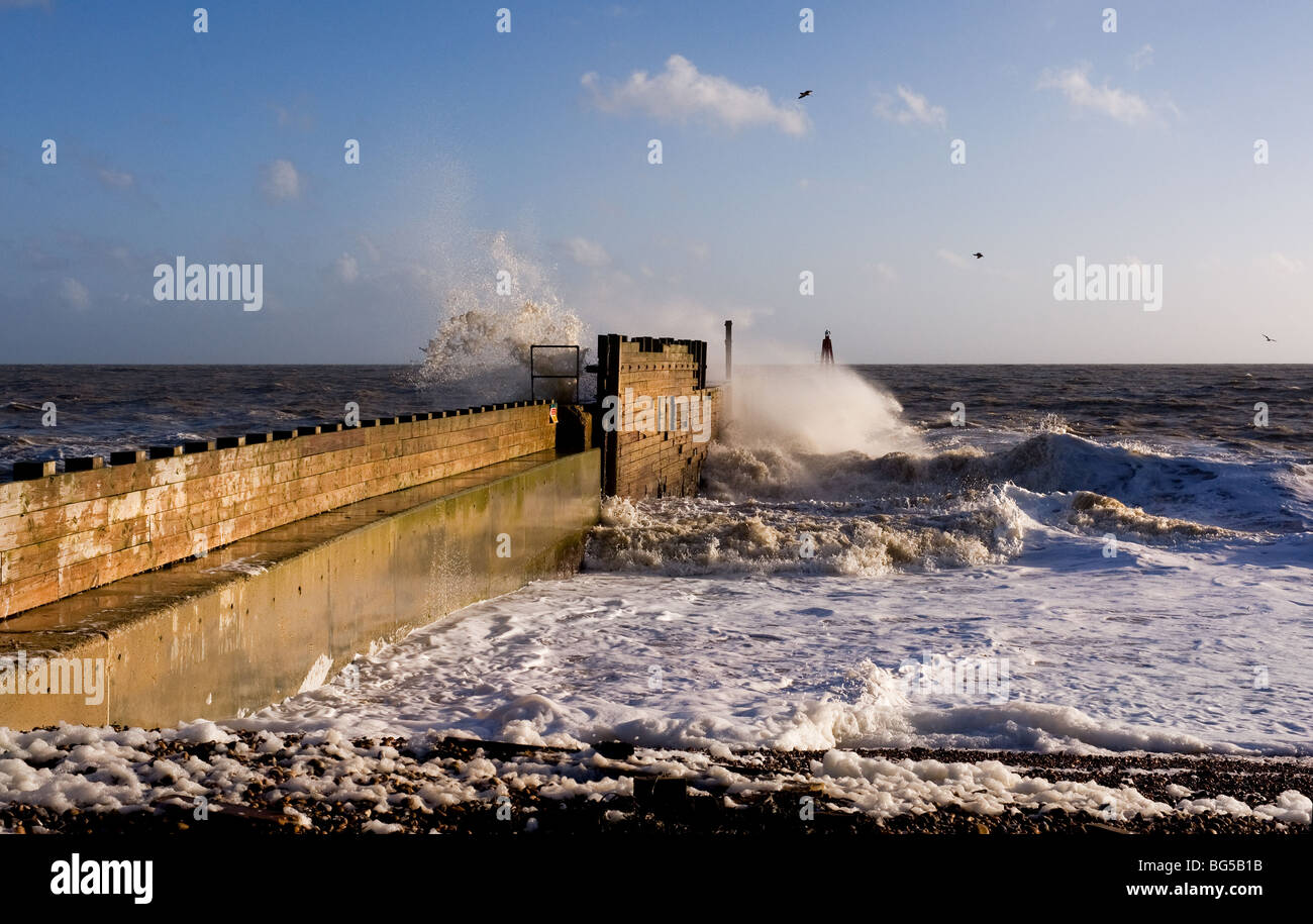 Rough sea at the entrance to Rye Harbour in East Sussex.  Photo by Gordon Scammell Stock Photo