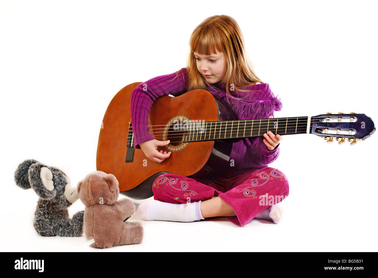 Young girl playing acoustic guitar Stock Photo - Alamy