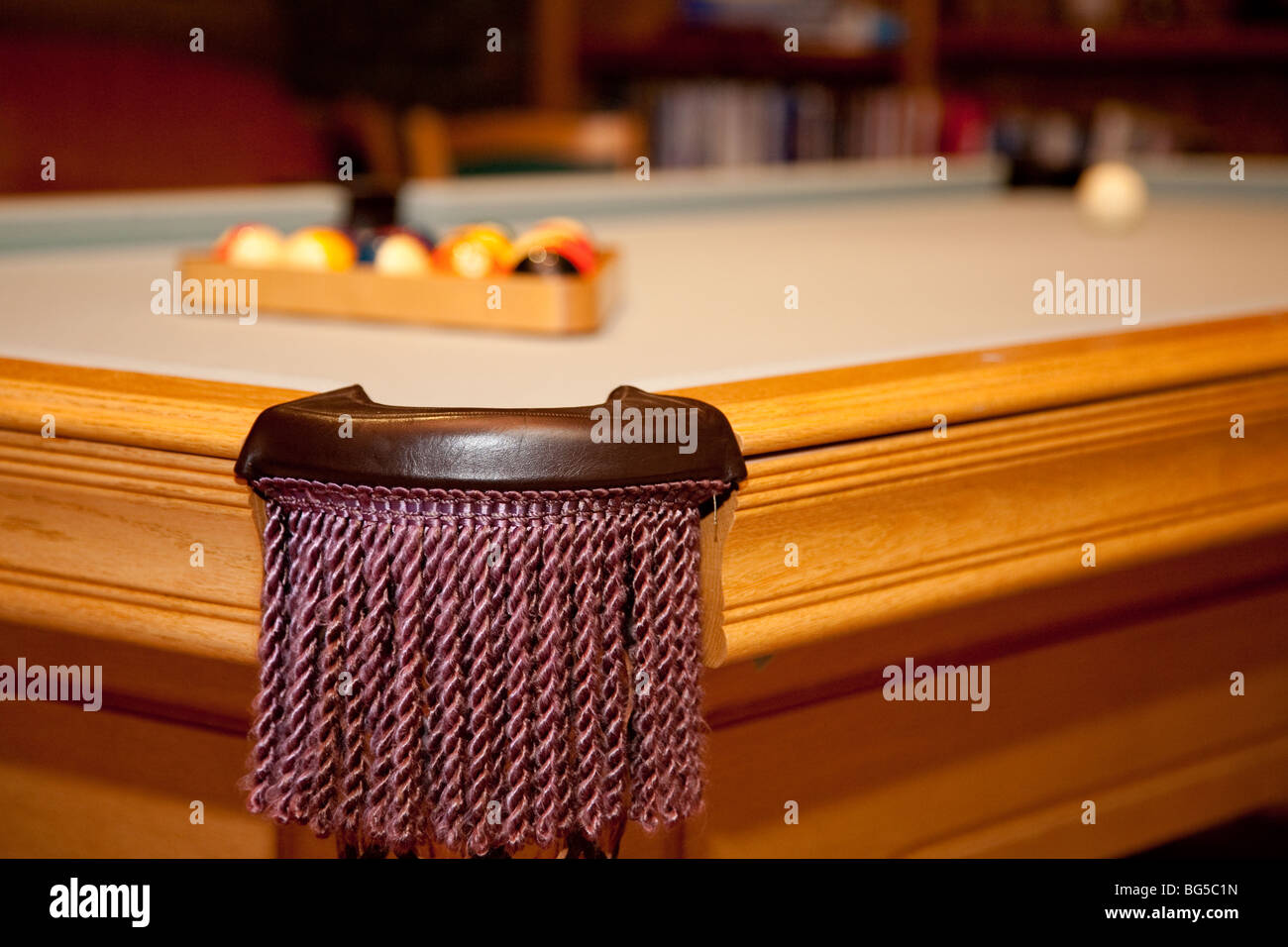 Corner pocket of pool table with billiards in the background Stock