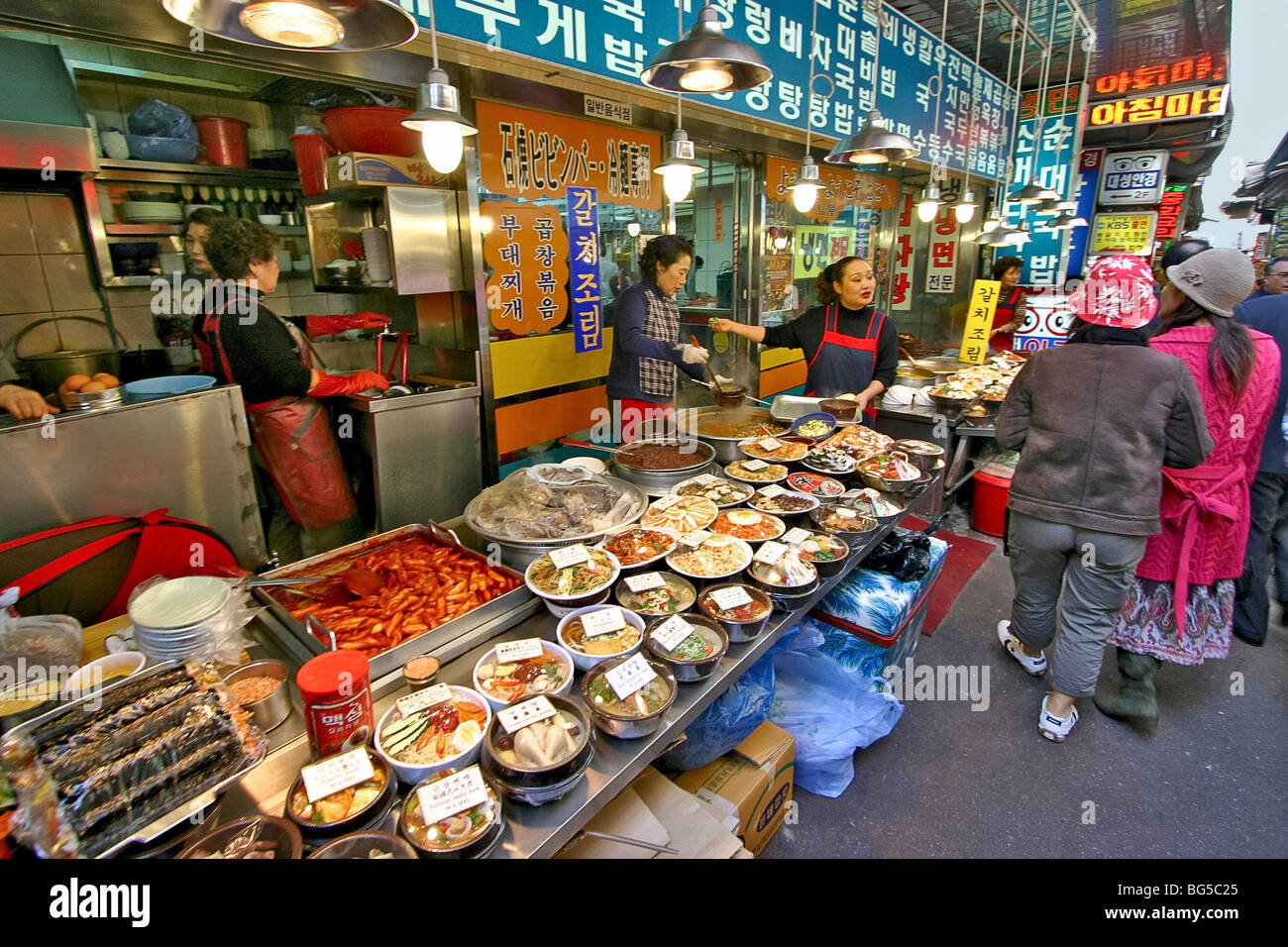 Namdaemun Market with people selling food on the street. Seoul, Korea. Stock Photo