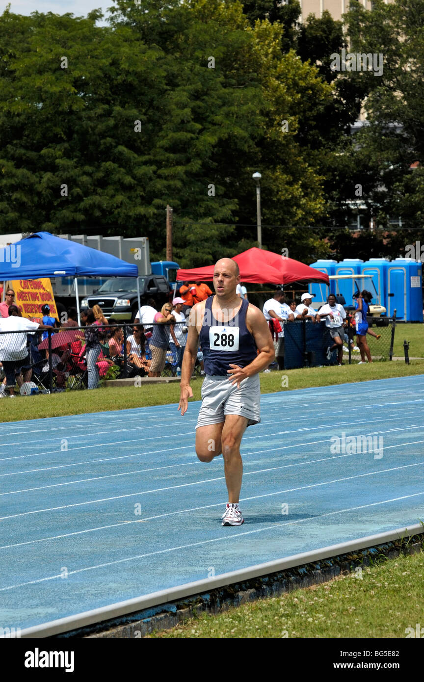 Adult man runner at the Track and Field competition during the