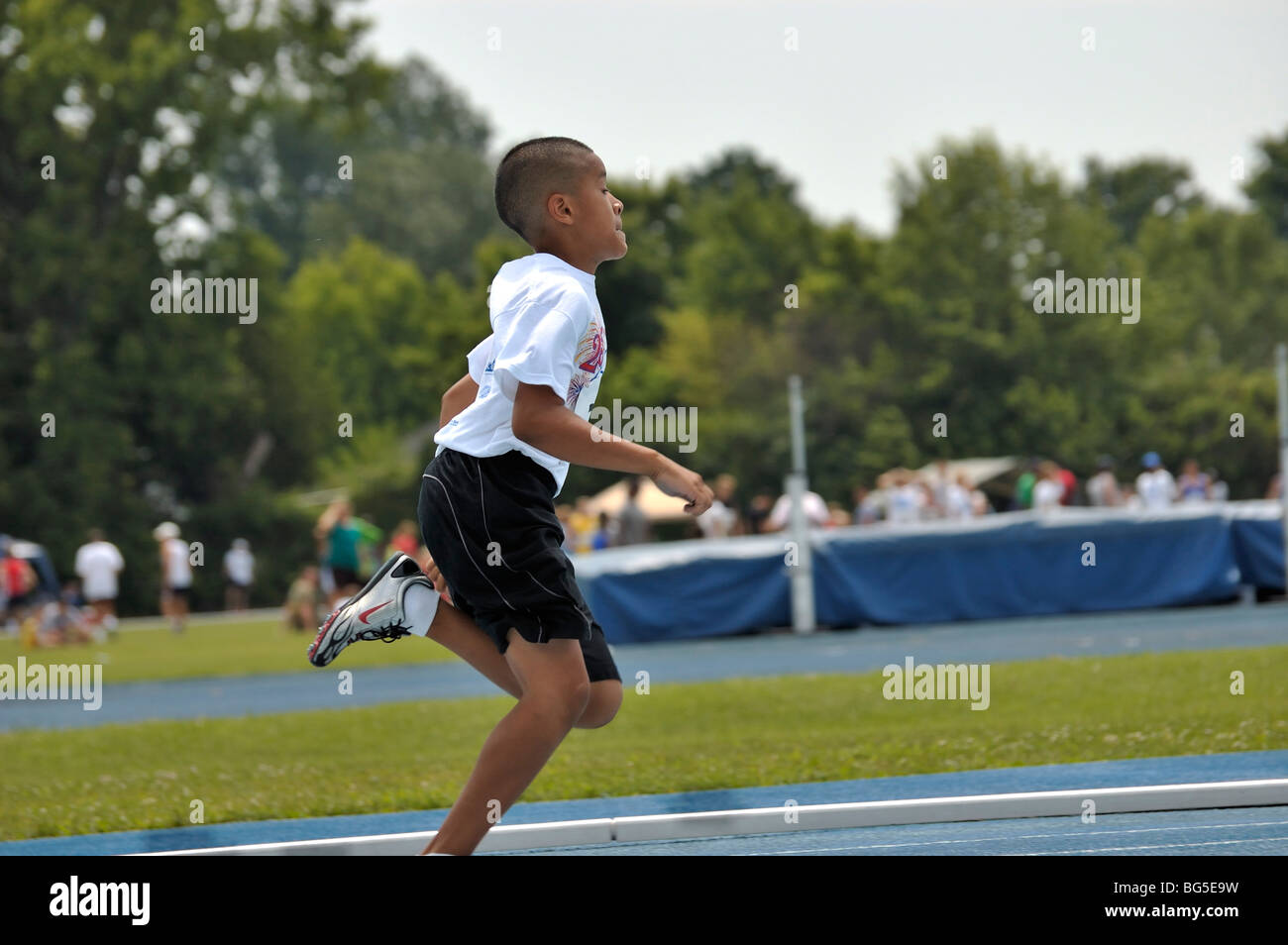 Young boy runner at the Track and Field competition during the