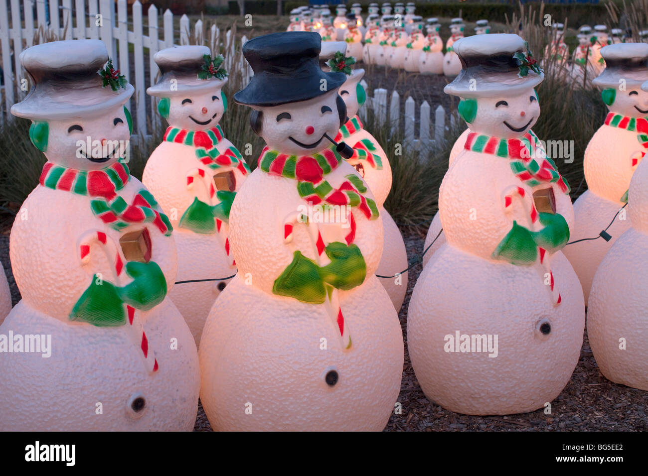 Lighted snowmen on parade with picket fence in background at Cornerstone  garden and sculpture center in Sonoma, California, USA Stock Photo - Alamy