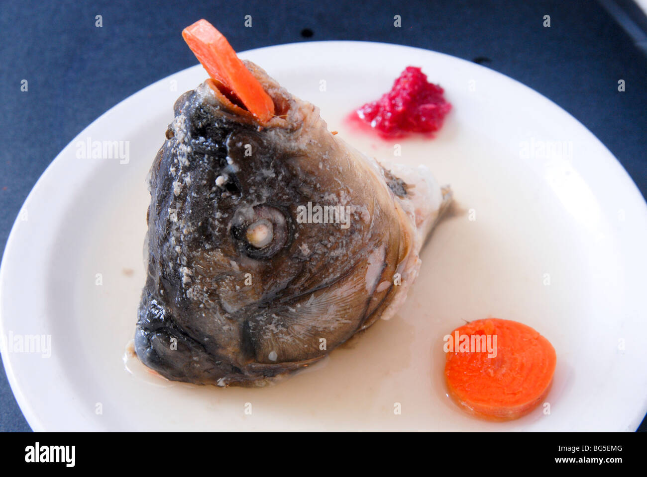 Head of Carp Gefilte fish or filled fish, are poached fish patties or balls made from a mixture of ground deboned fish Stock Photo