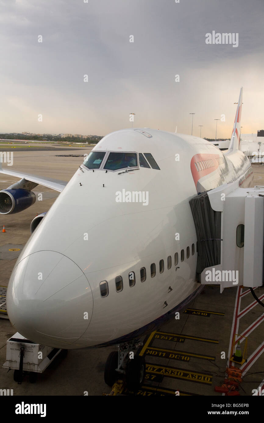 Passenger plane with airbridge at Sydney Airport Stock Photo