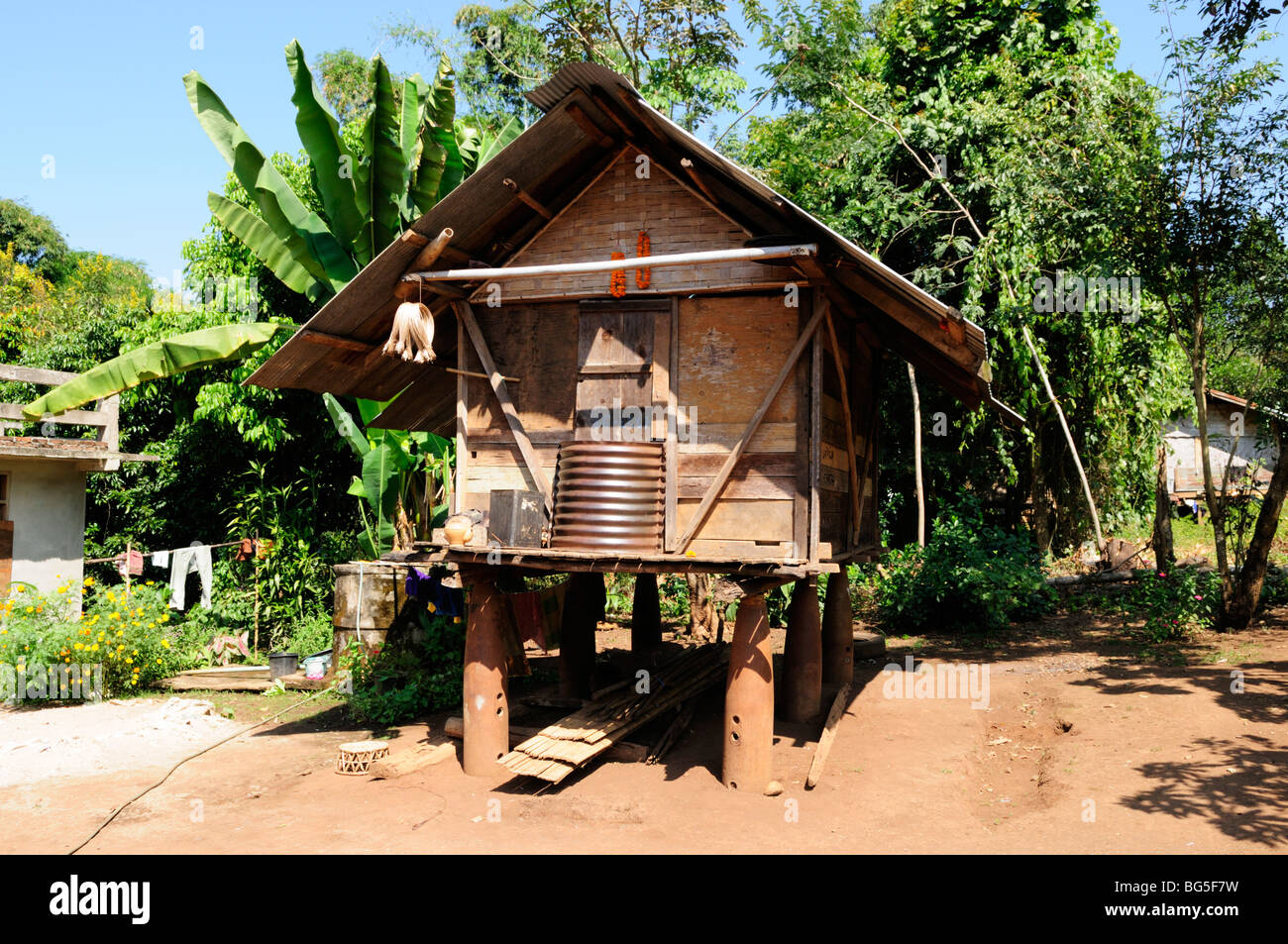 Laos; Bokeo province; Hut built on 500Kg bomb casings from the 1970's Indochina War, Located in a village near Huay Xai Stock Photo