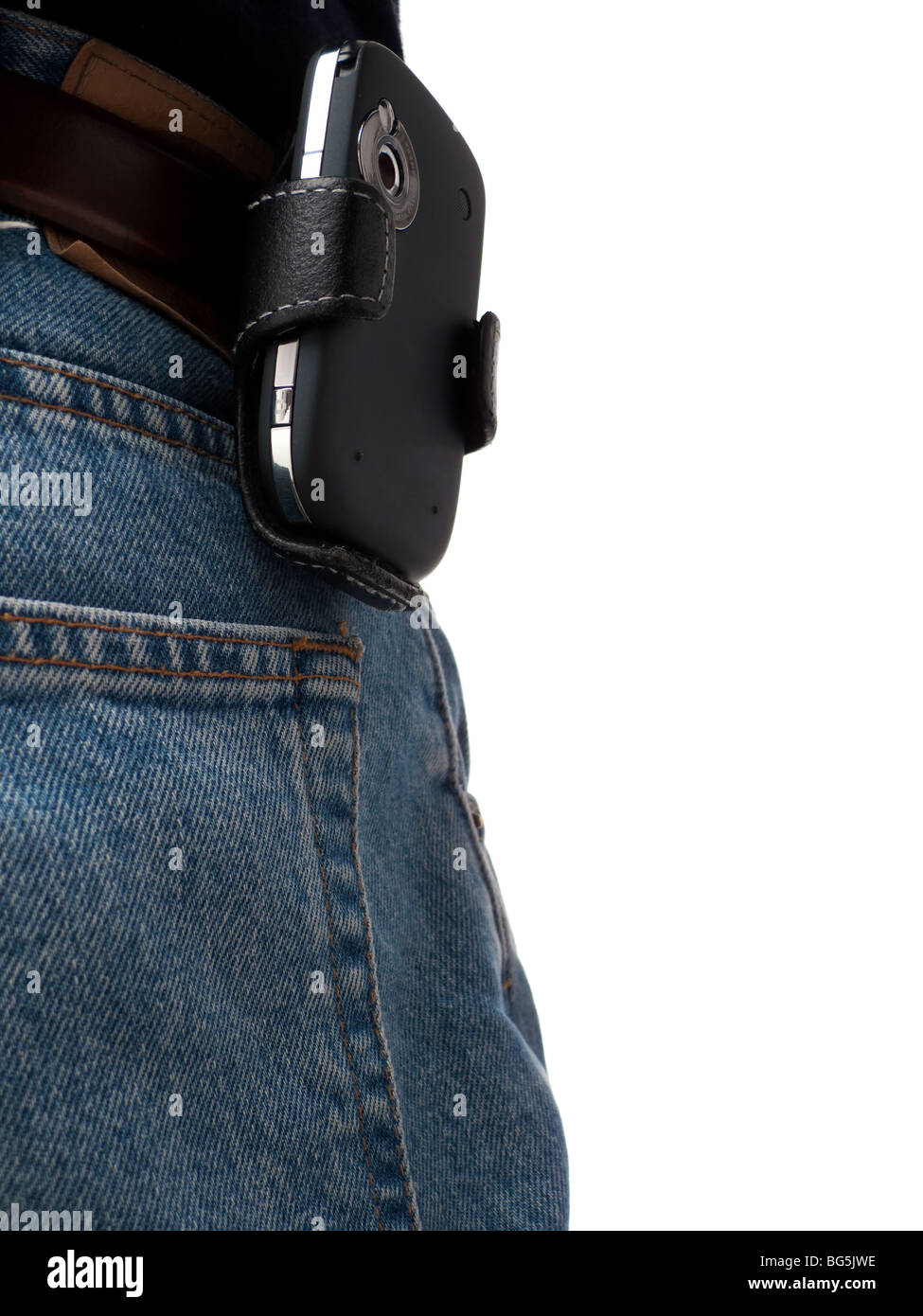 A PDA (Windows Mobile device) in a holster, attached to a belt of an IT worker, wearing jeans, shot from behind. Stock Photo