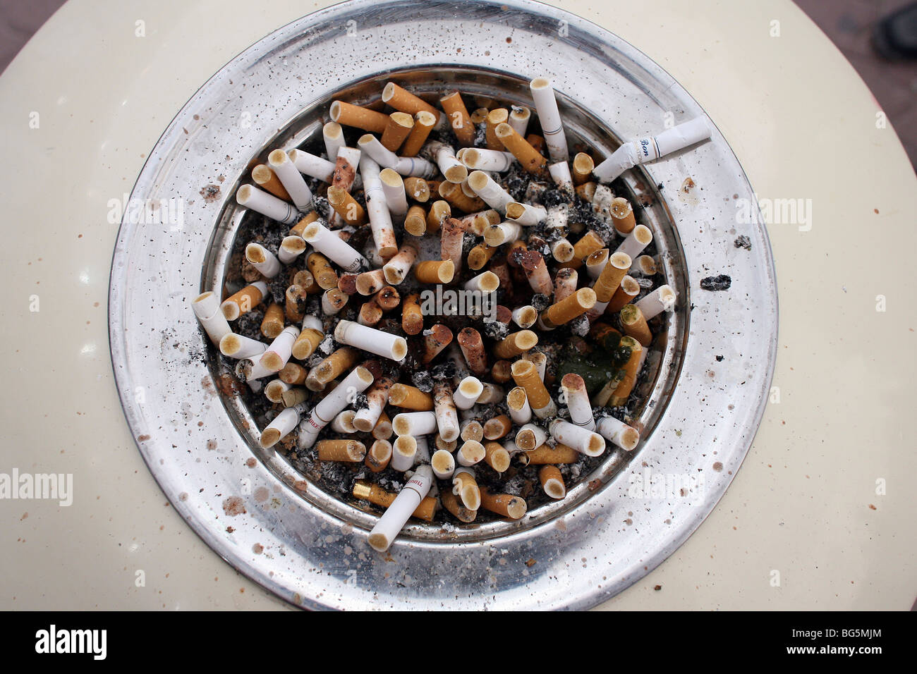 Cigarette butts in an ashtray Stock Photo