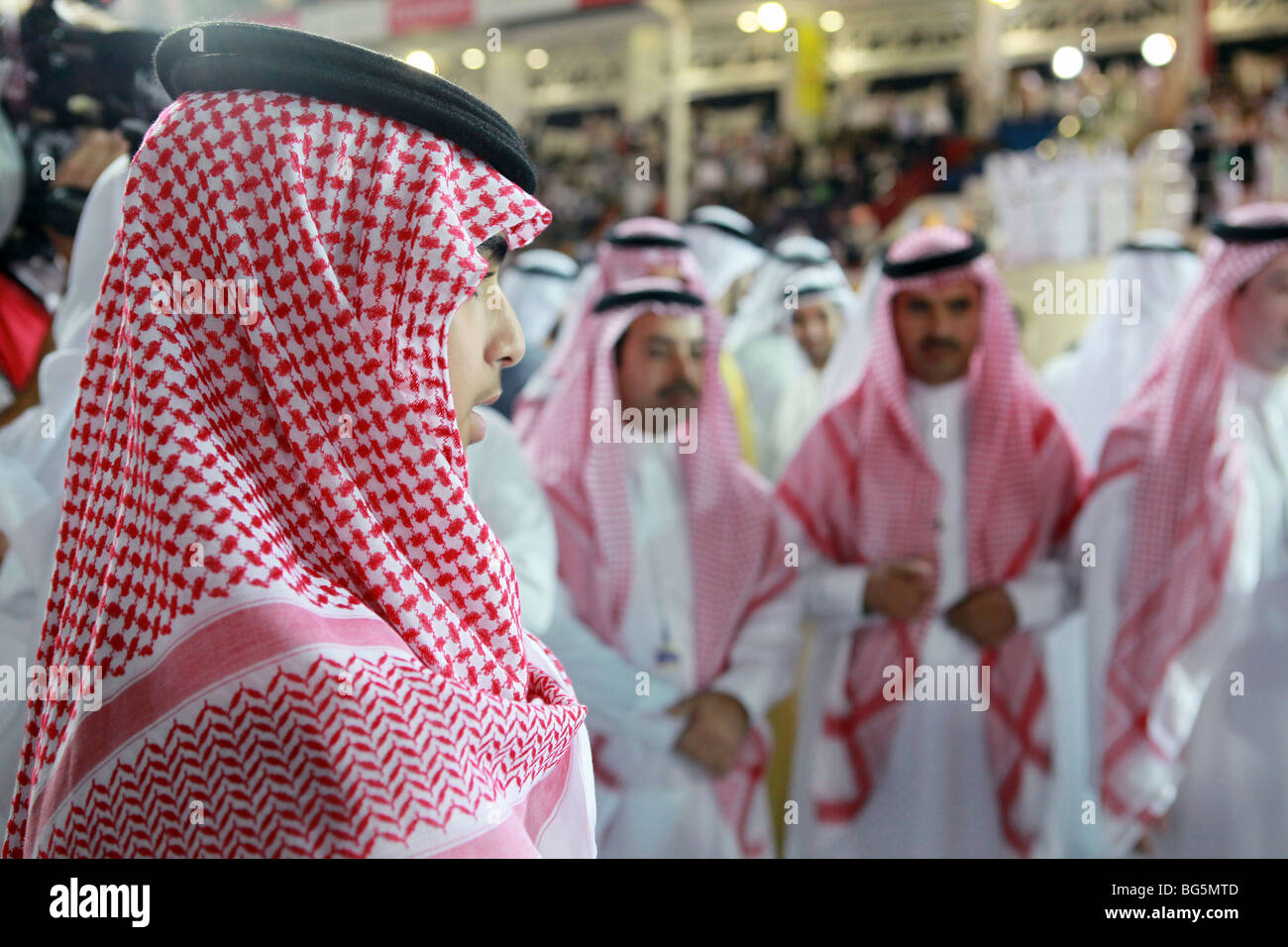 Men in traditional clothing, Dubai, United Arab Emirates Stock Photo