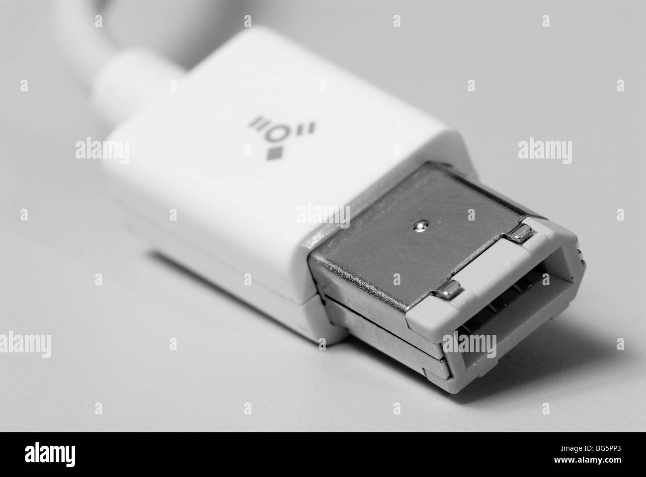 Close up of Firewire 400 data transfer connectivity cord. Stock Photo