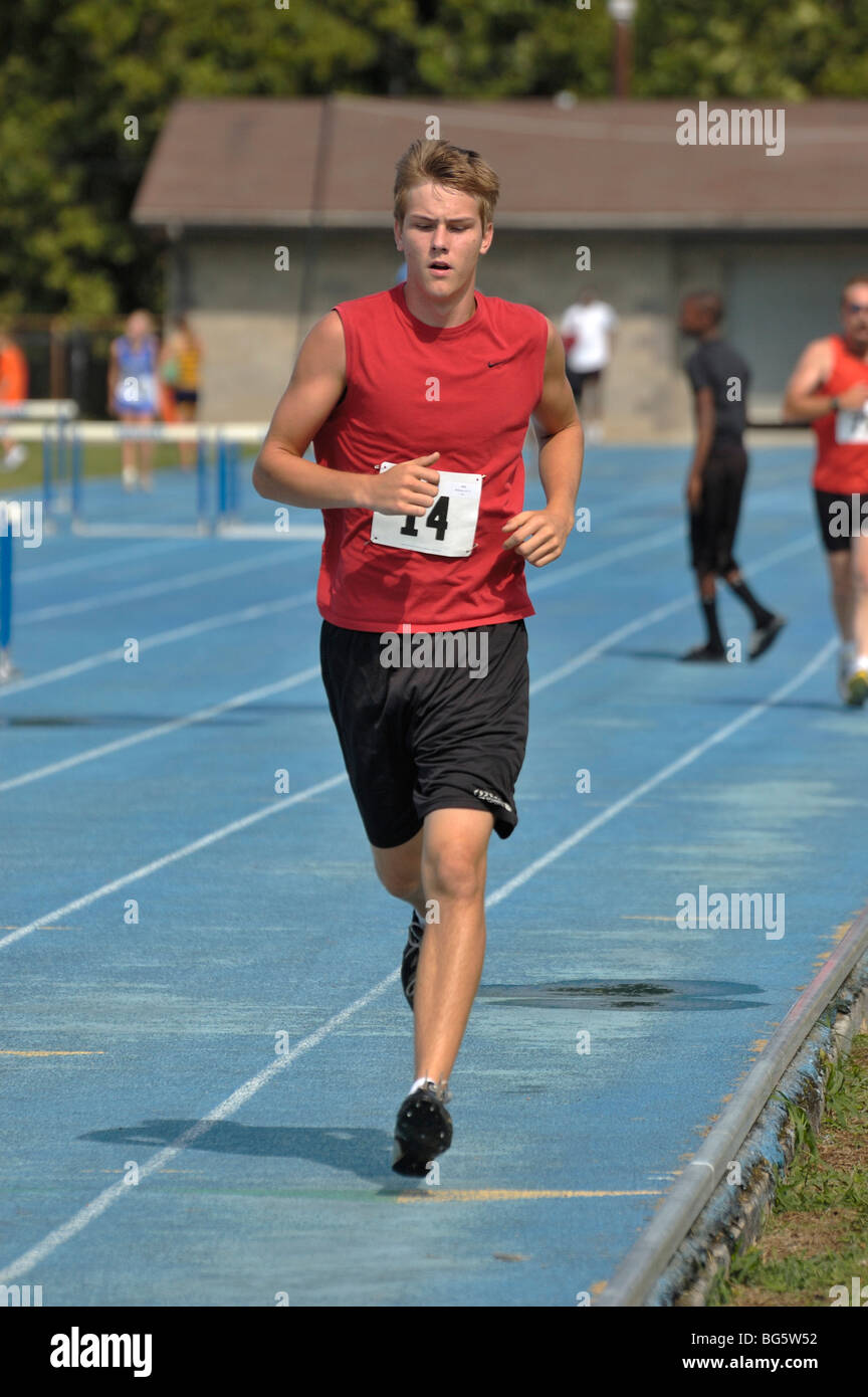 Teenage boy runner at the Track and Field competition during the