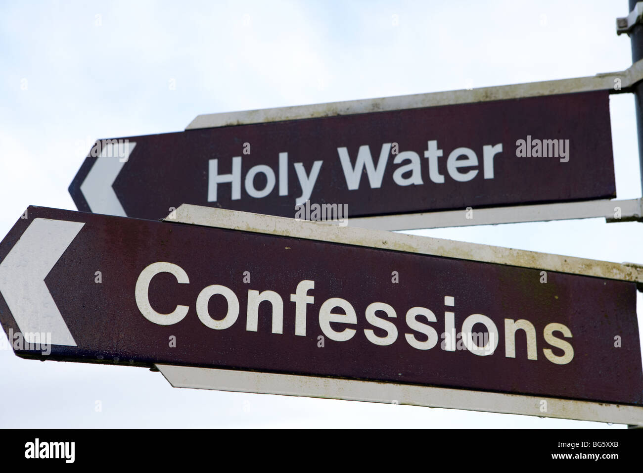confessions and holy water signs at knock marian shrine county mayo republic of ireland Stock Photo