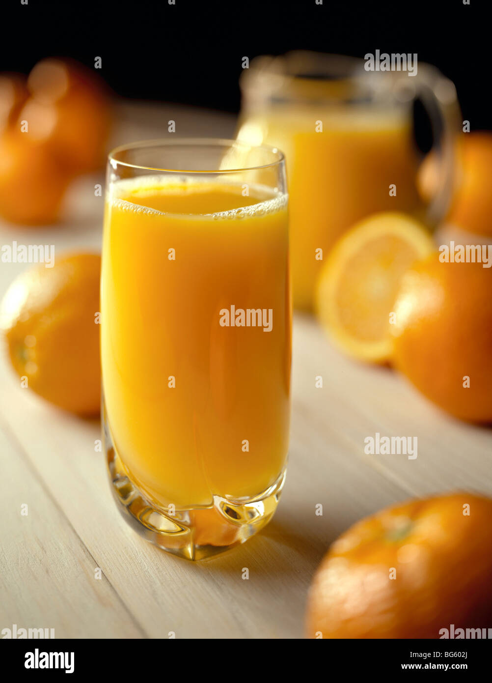 Glass of orange juice with pitcher Stock Photo Alamy