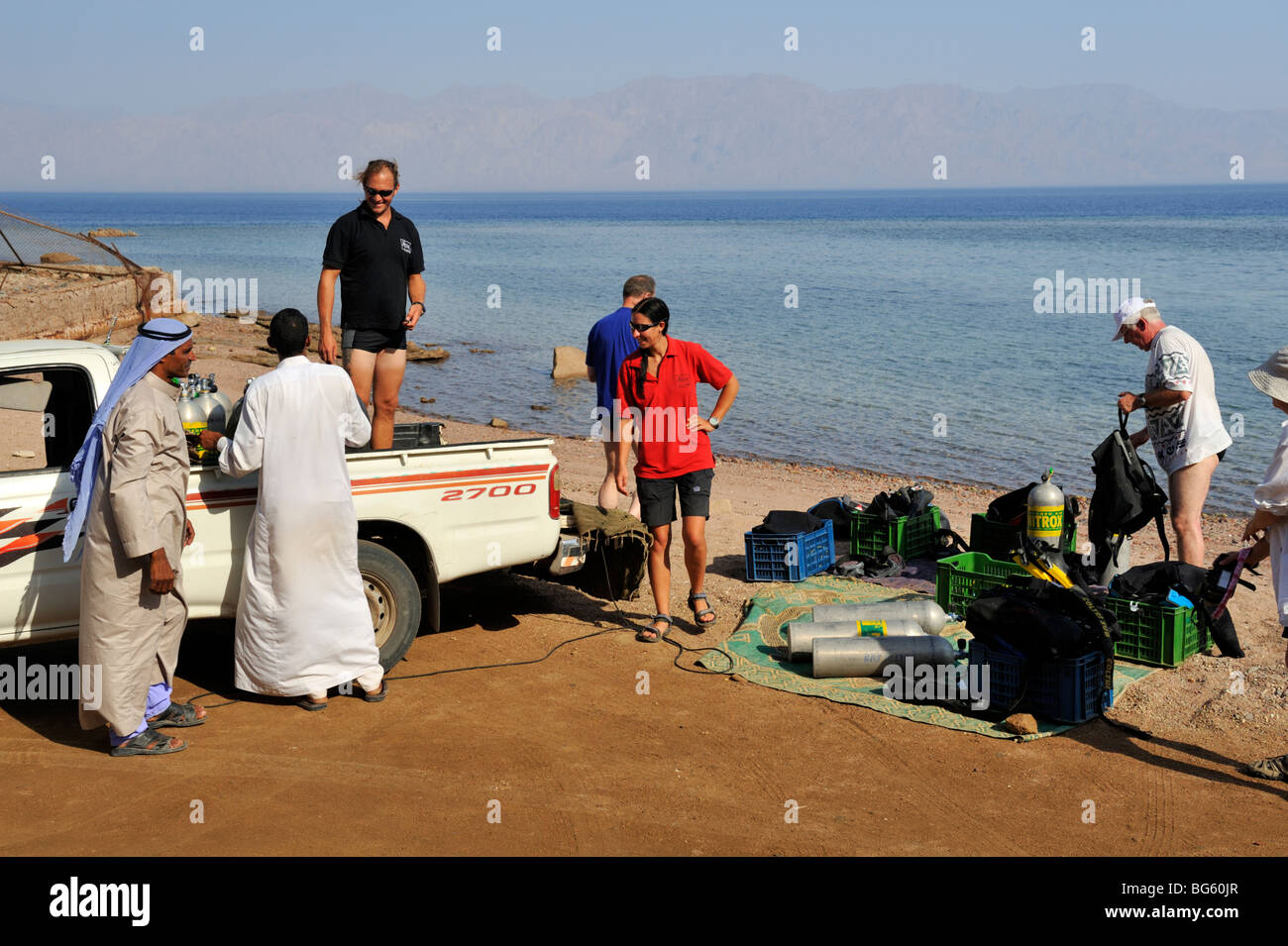 Scuba divers on expedition organizing for a shore dive Ras Abu Ghalum National Park, Sinai, 'Red Sea', Egypt Stock Photo