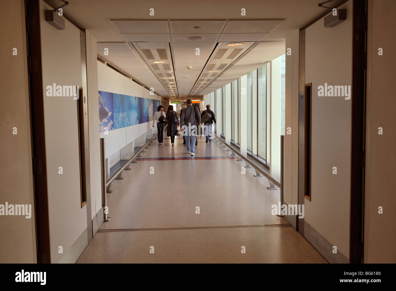 Long hallway inside airport departure terminal Gatwick North, London