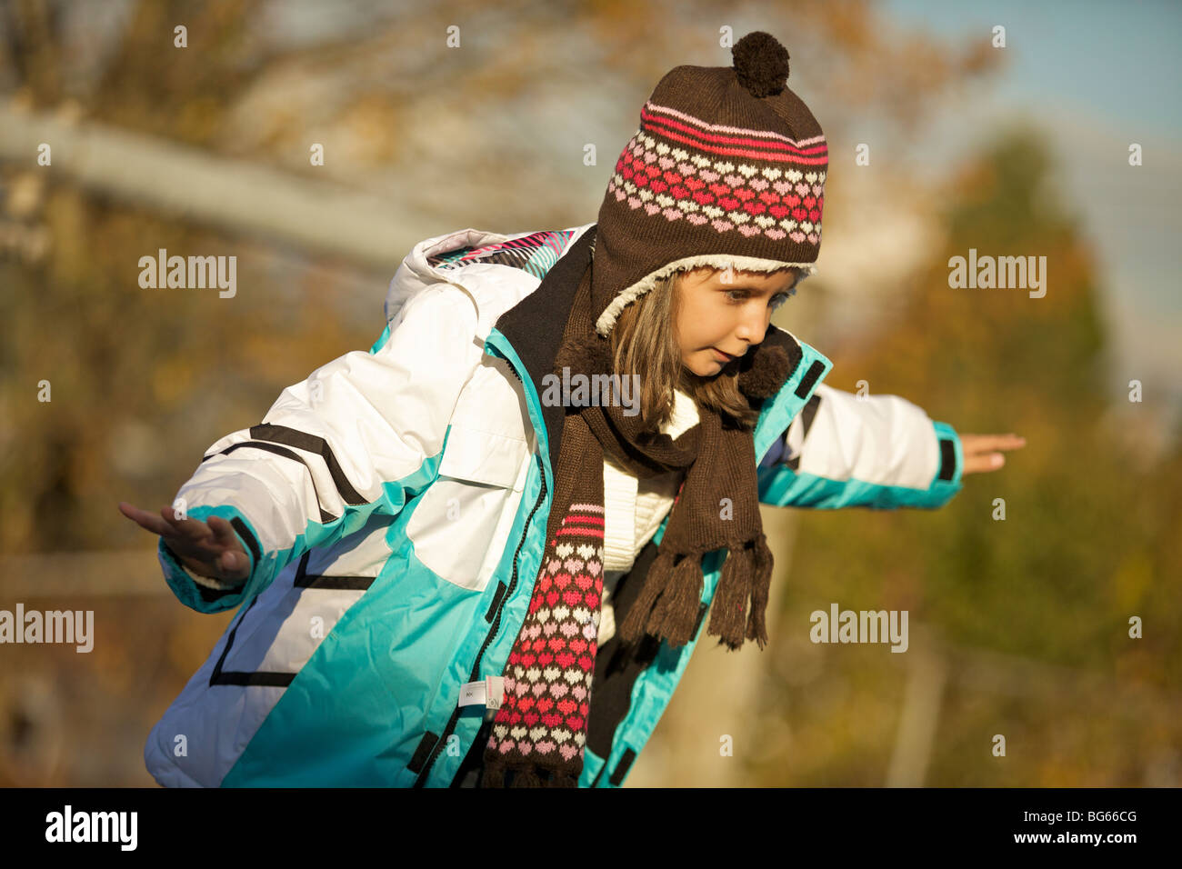 Happy young girl playing at the playground Stock Photo - Alamy