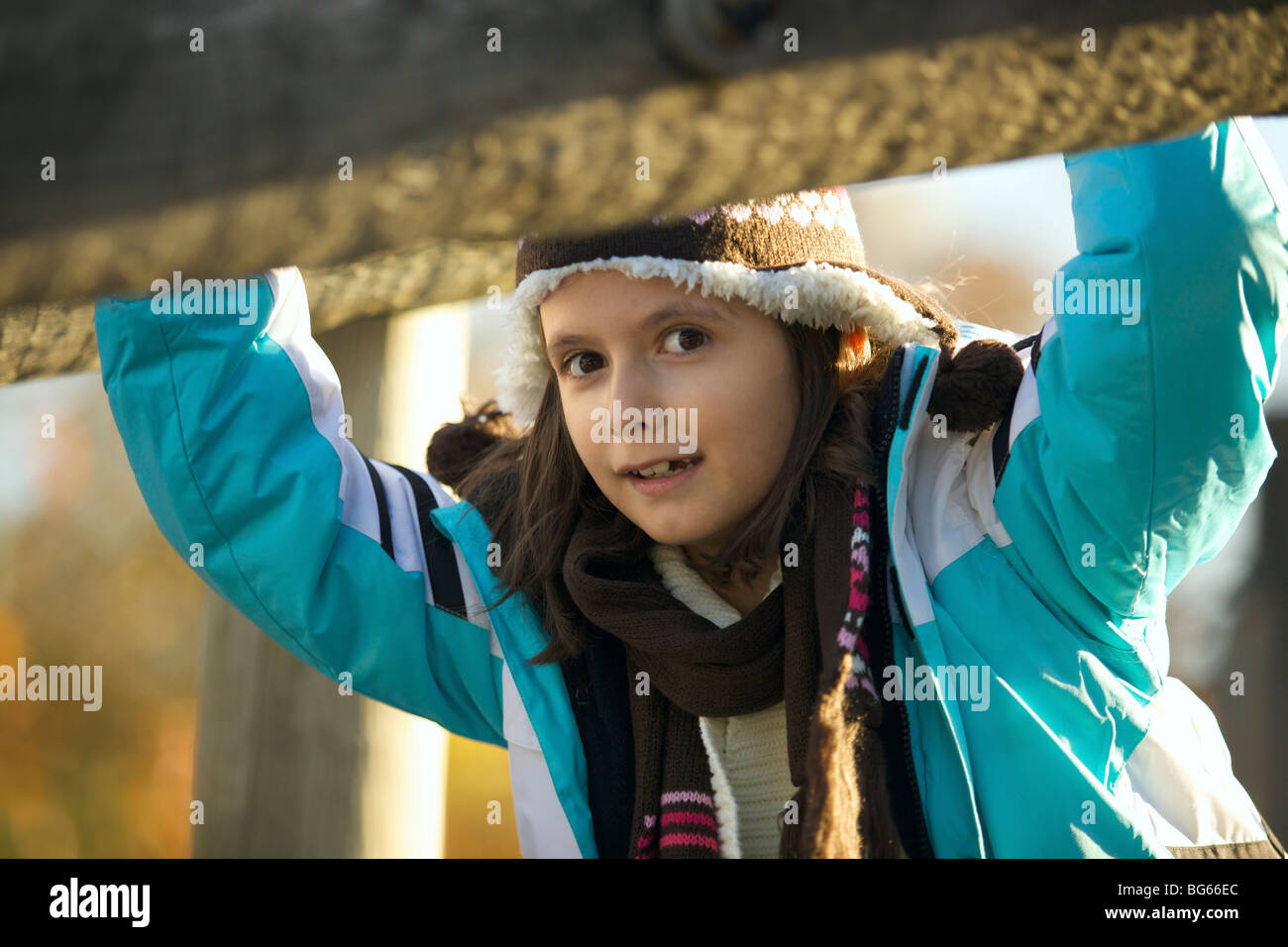 Happy young girl playing at the playground Stock Photo - Alamy