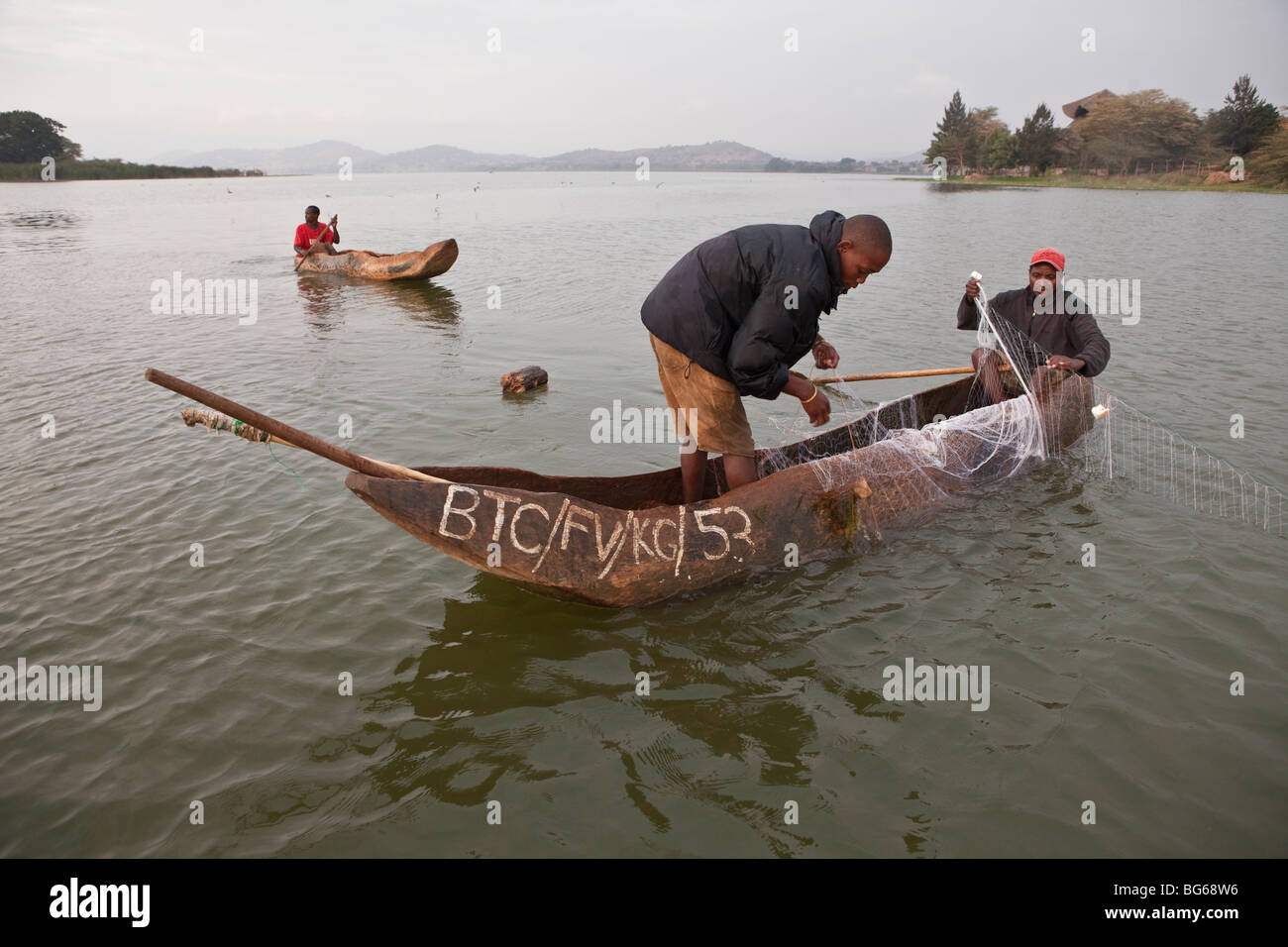 Fishermen fish in the waters of Lake Babati in Central Tanzania. Stock Photo