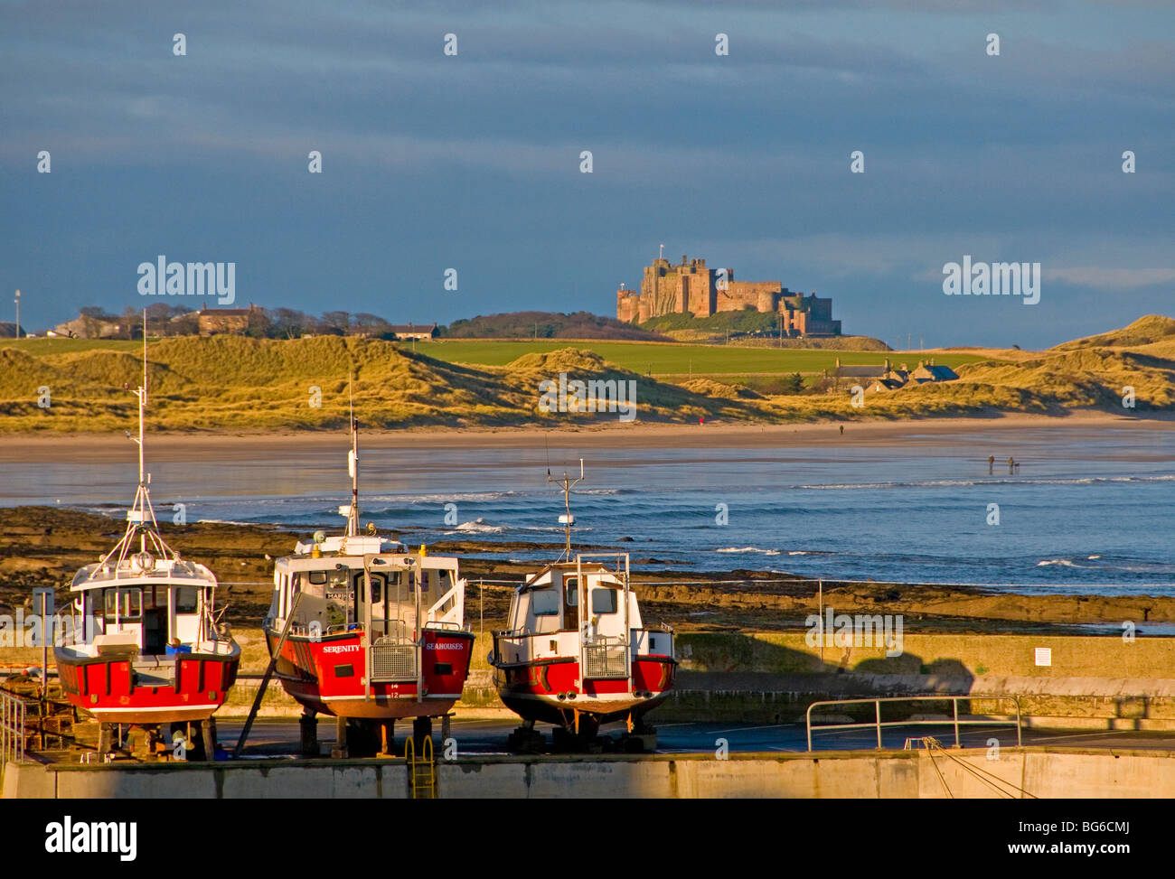 Bamburgh Castle from Seahouses harbour on the East Heritage Coast of North Sunderland  SCO 5597 Sunderland Stock Photo