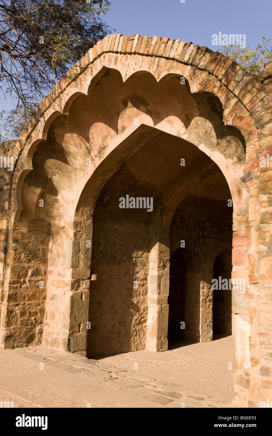 The arched Mughal era entrance gate to the Qutb Minar Complex in Delhi, India. Stock Photo