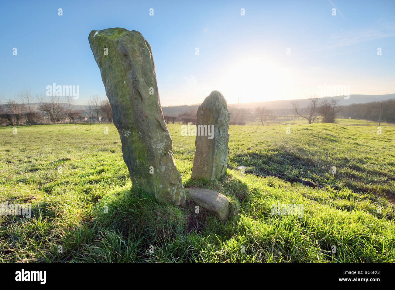 Squeeze post type stile left standing in a field after the wall has been removed Stock Photo