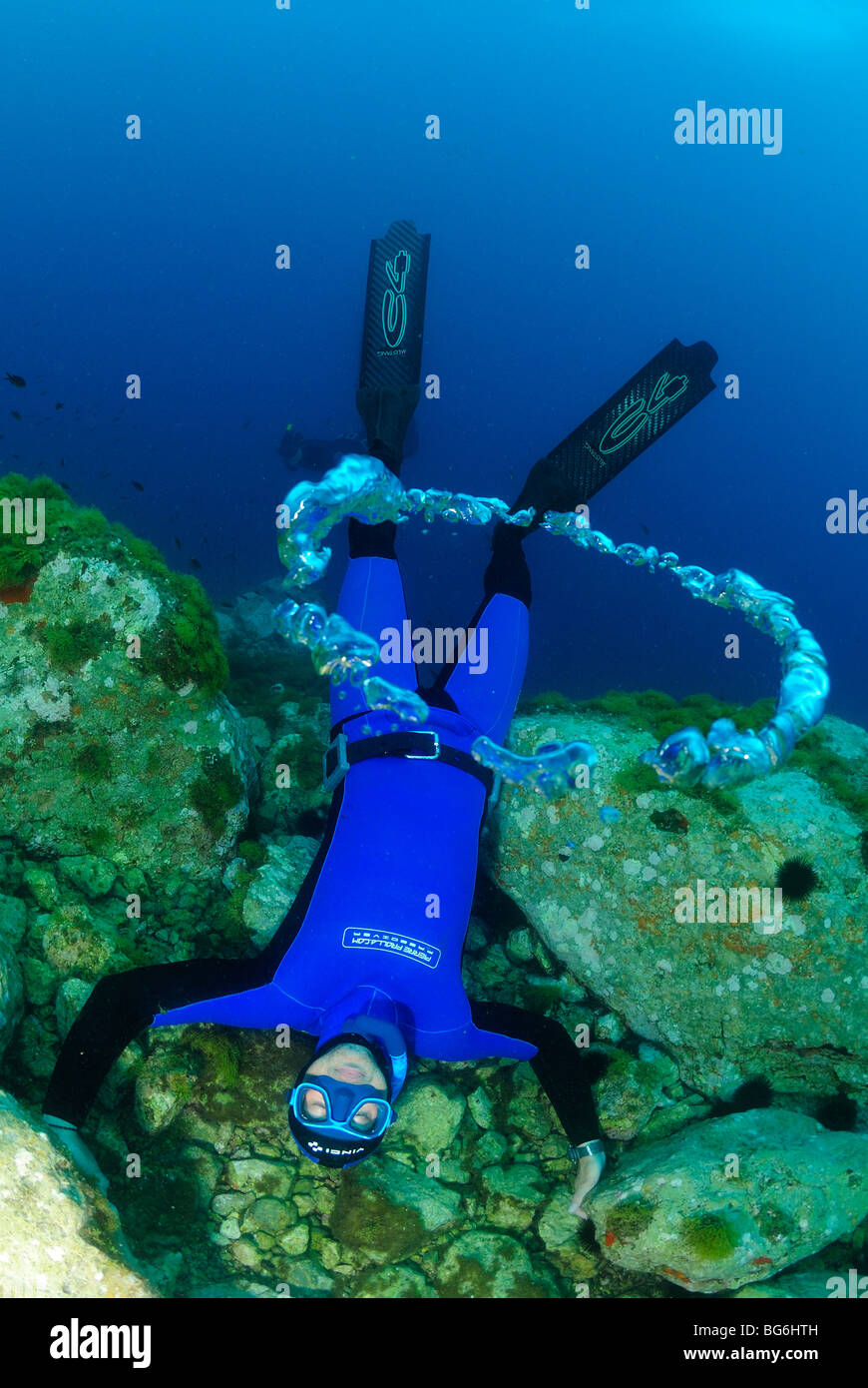 Free diver bubbling in the Mediterranean Sea, off Monaco Stock Photo