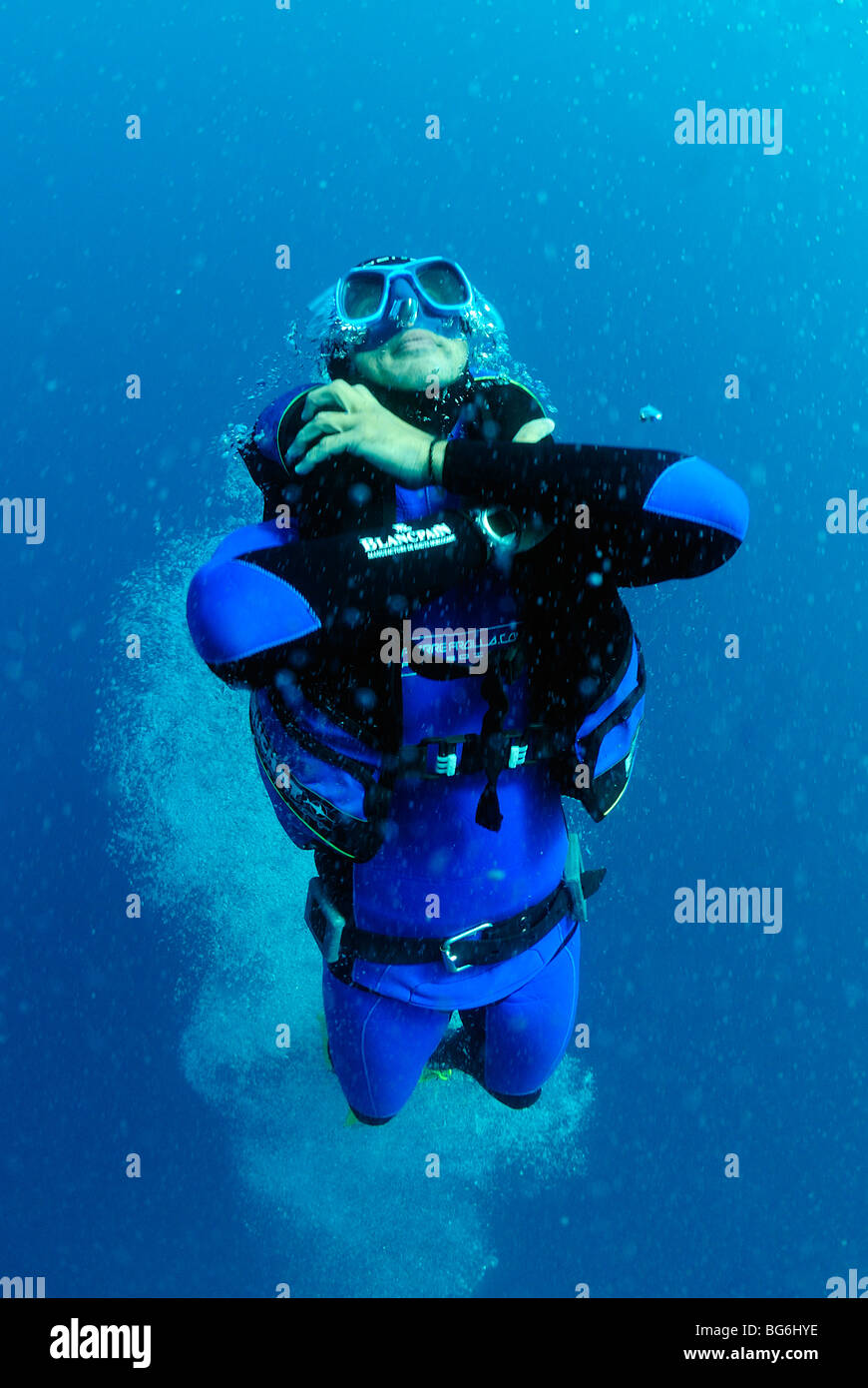 Free diver going up with an inflatable BCD in the Mediterranean Sea, off Monaco Stock Photo
