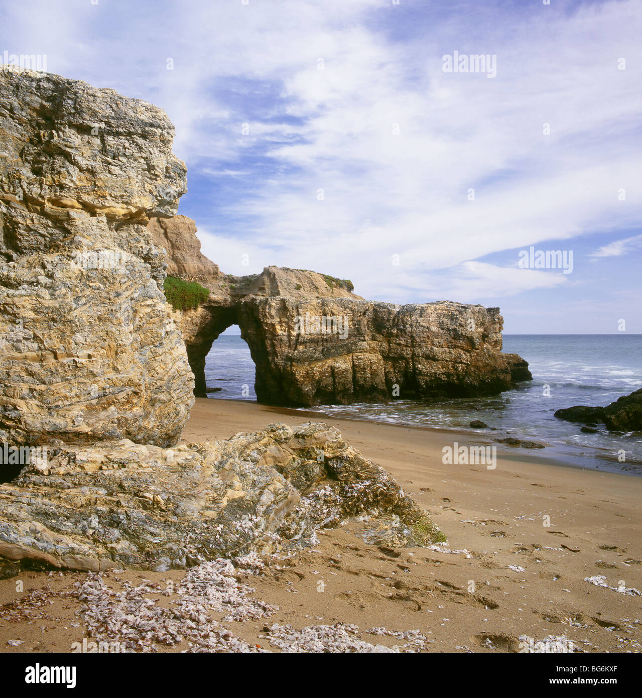 CALIFORNIA - The Pacific Coast viewed through an arched rock at Sculptured Beach in Point Reyes National Seashore. Stock Photo