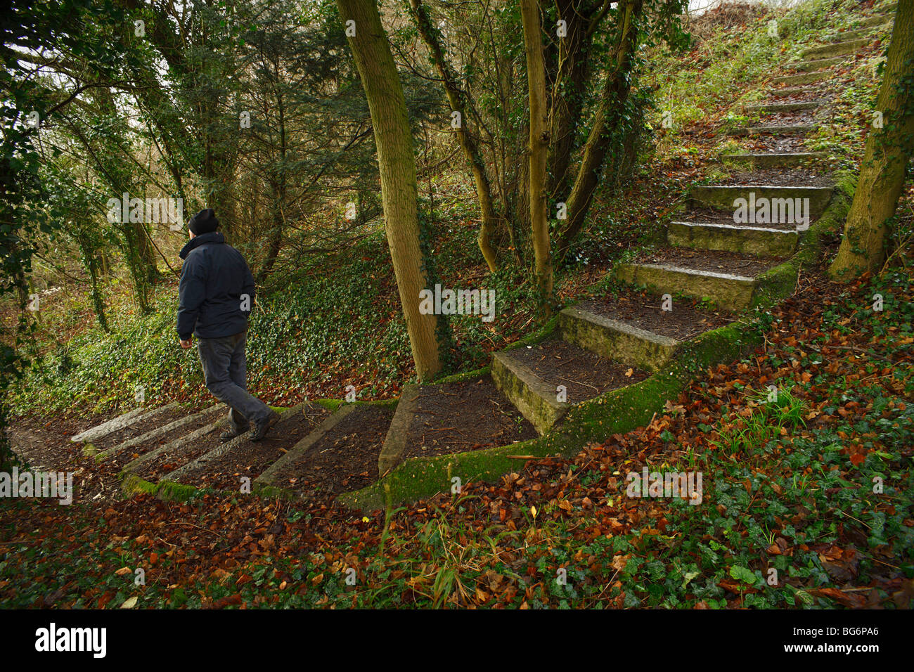 Person walking down a set of stone steps. Stock Photo