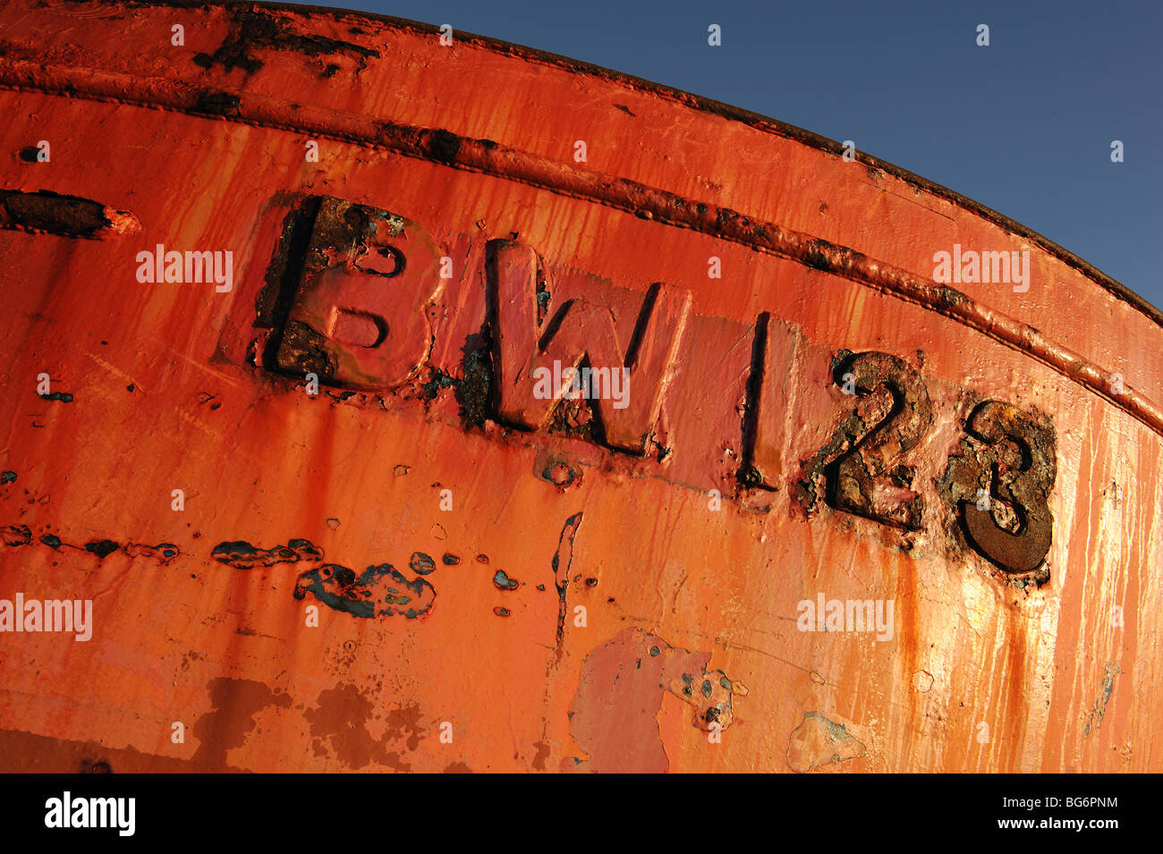 Bright red and rusty fishing boat with number Stock Photo Alamy