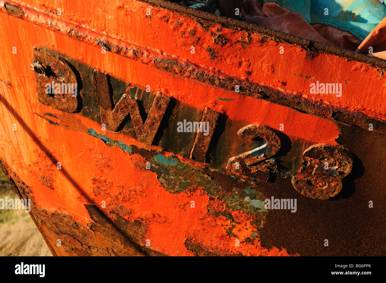 Detail of bright red and rusty fishing boat with number Stock Photo Alamy