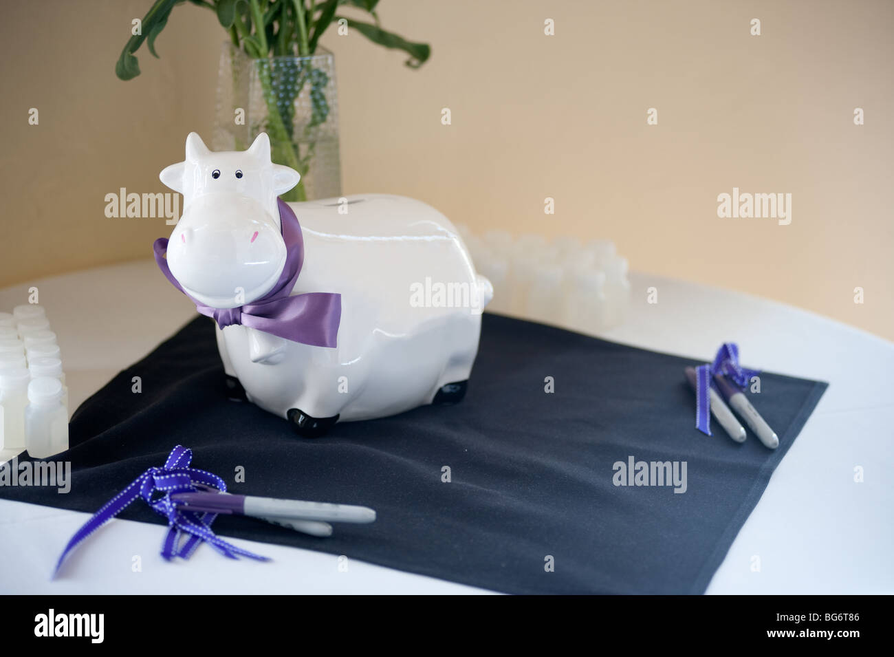 Porcelain cow for guests to sign at wedding reception Stock Photo