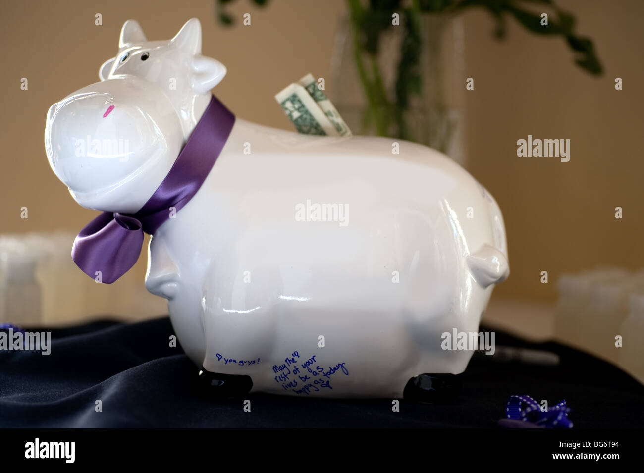Porcelain cow for guests to sign at wedding reception Stock Photo