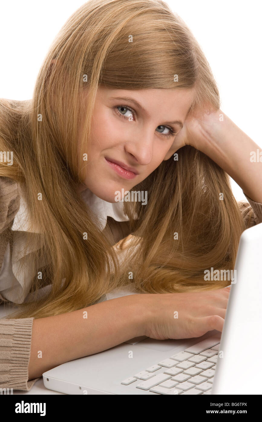 Teenage girl using laptop computer lying down on stomach Stock Photo Alamy