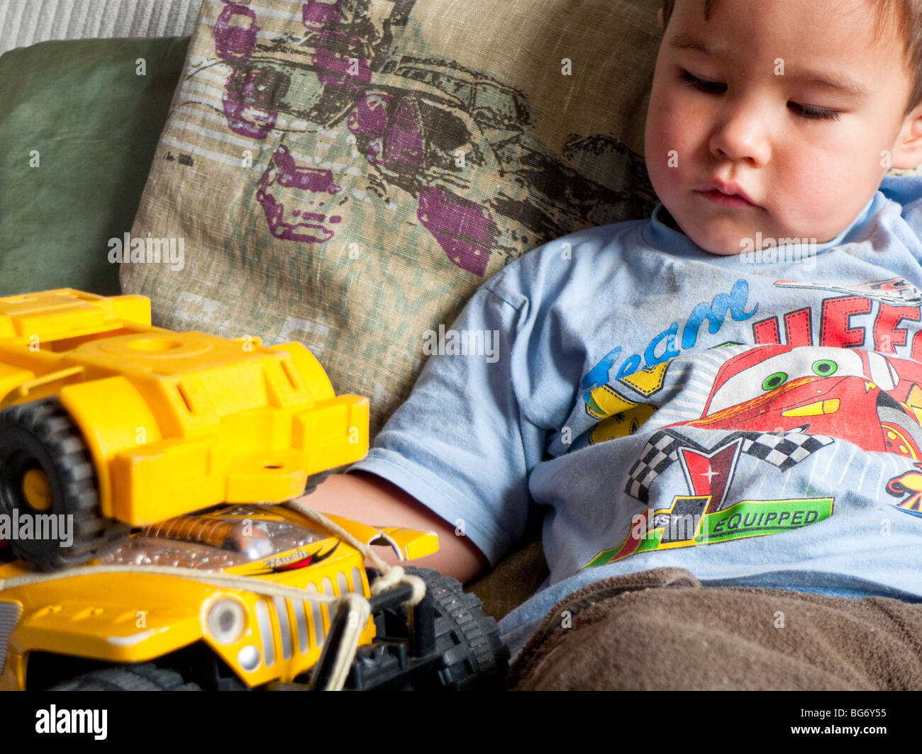 Little boy playing with toys Stock Photo - Alamy