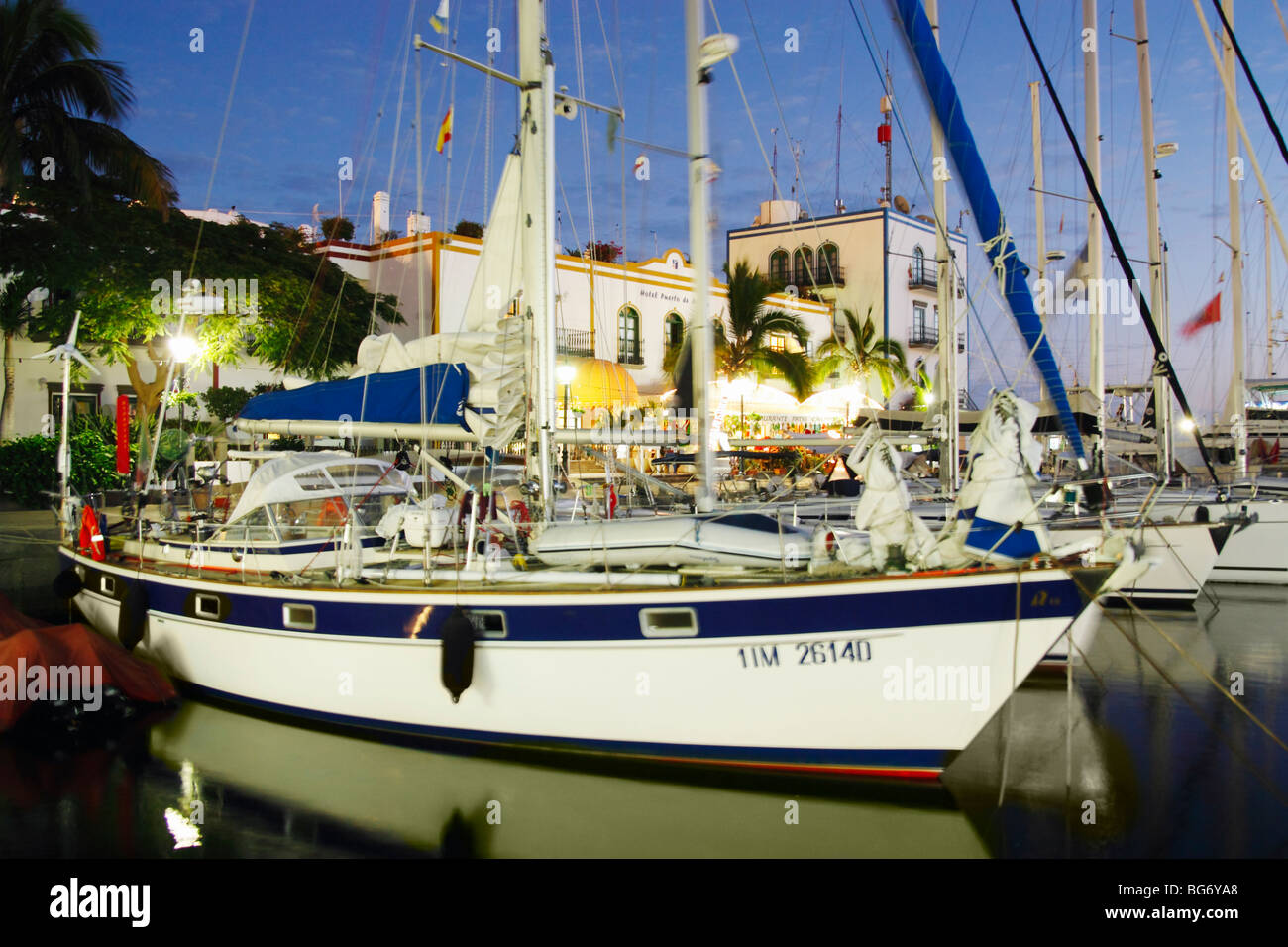 Yachts moored in front of restaurants and hotel in Puerto de Mogan on Gran Canaria in the Canary islands Stock Photo
