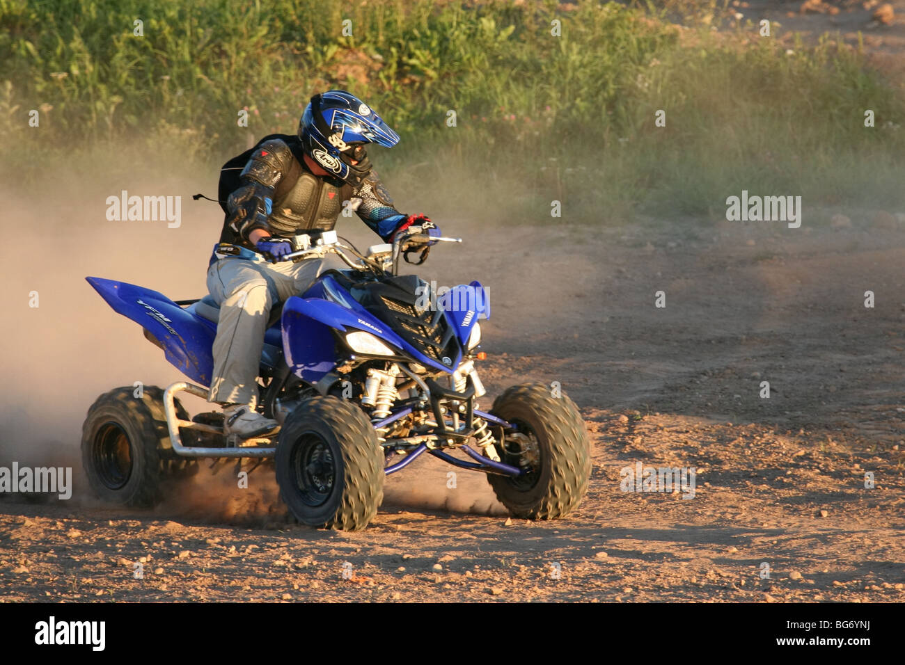 Riding a quad Stock Photo - Alamy